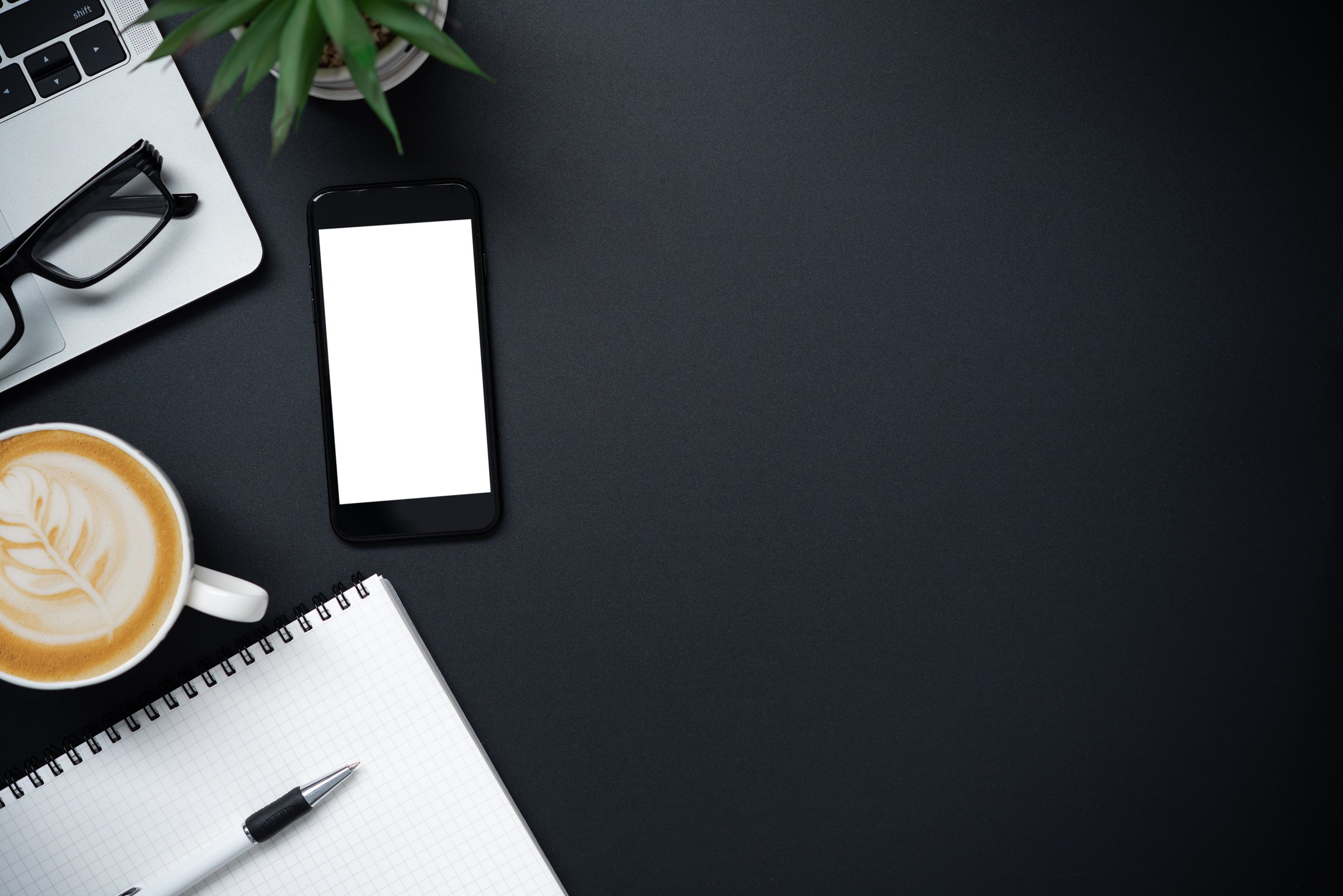 Office Stationery and Smartphone on Dark Desk 